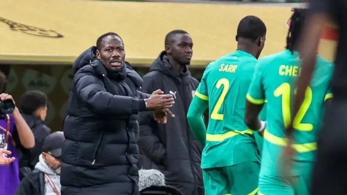 Senegal 's head coach Pape Thiaw urging his players to storm out of the pitch during the AFCON final against Morocco. Senegal 's head coach Pape Thiaw urging his players to storm out of the pitch during the AFCON final against Morocco.